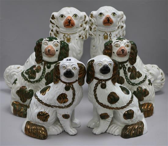 Three pairs of graduated Staffordshire pottery dogs tallest 33cm